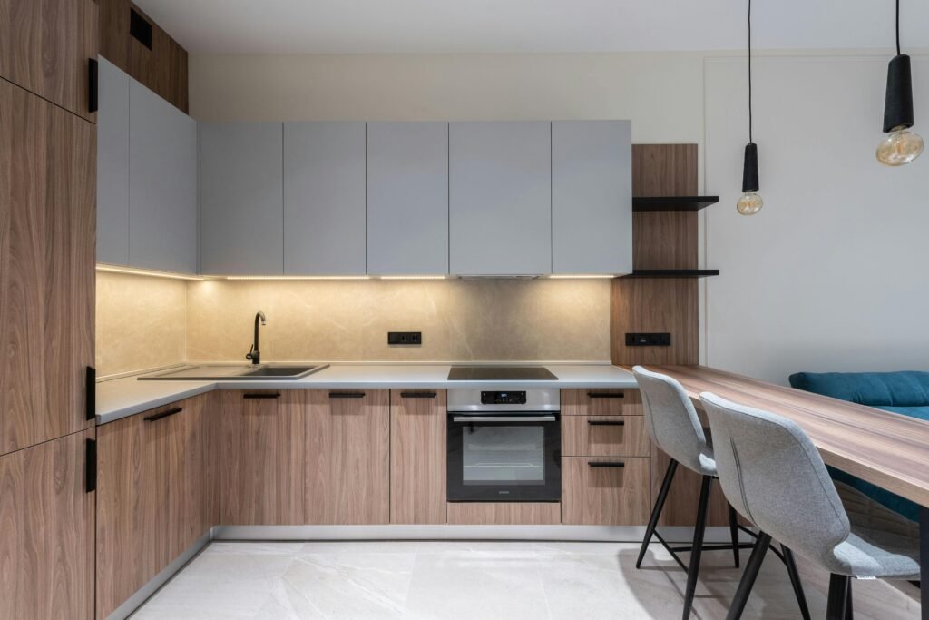 Sleek contemporary kitchen interior with wood accents and modern appliances.